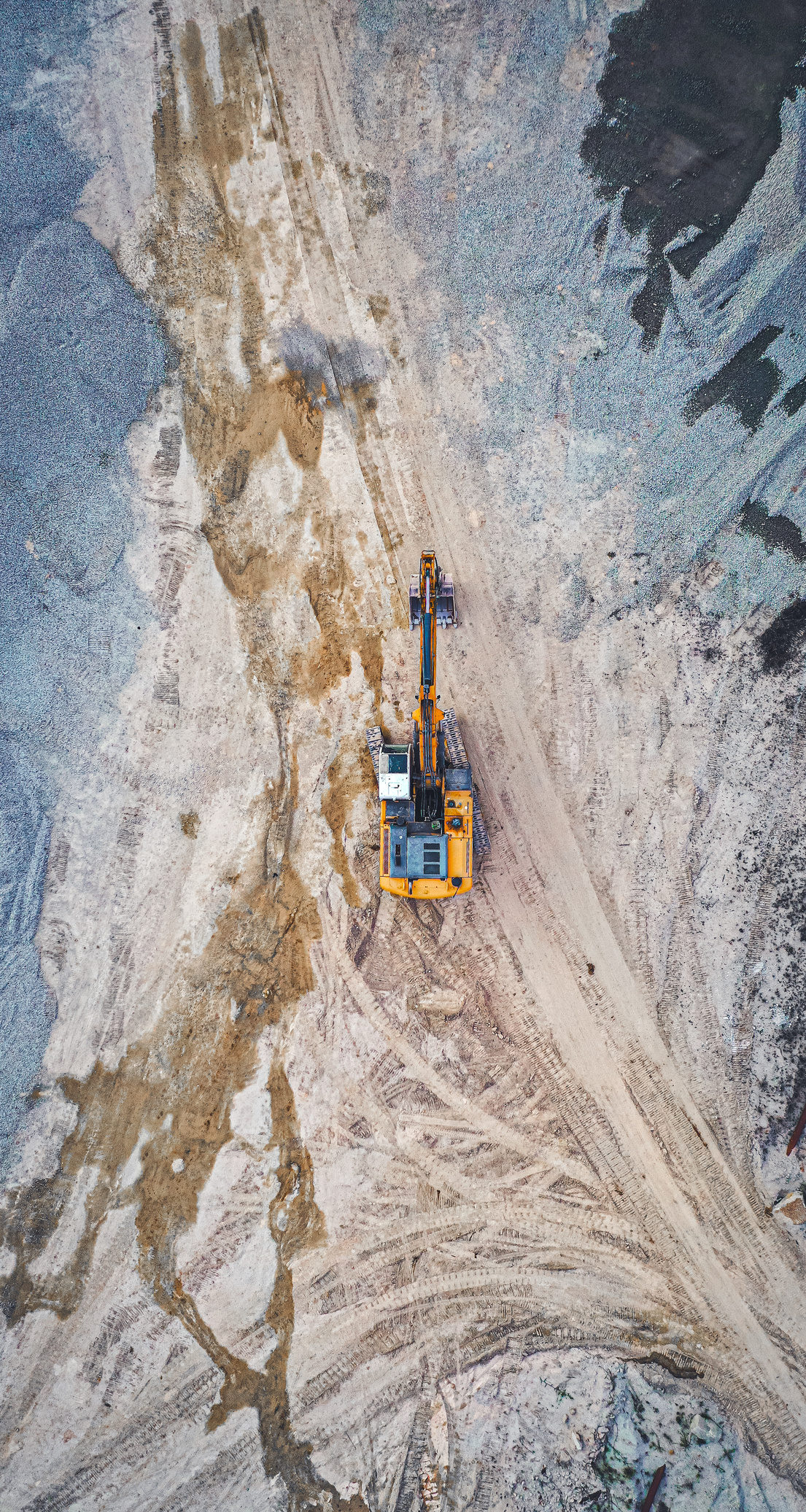 Top View of Excavator Standing in Fields 